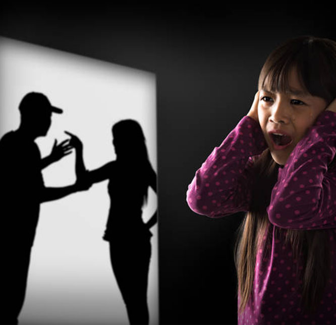 A distressed girl watches a shadow of a man yelling at a woman.