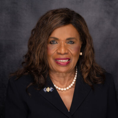 Professional portrait of a woman with pearl necklace and blazer. Professional portrait of a woman with pearl necklace and blazer.